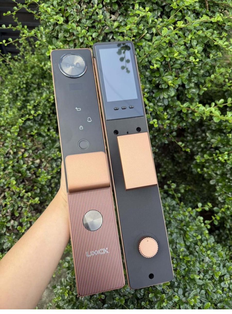 Technician holding LOOCK lock hardware before installation